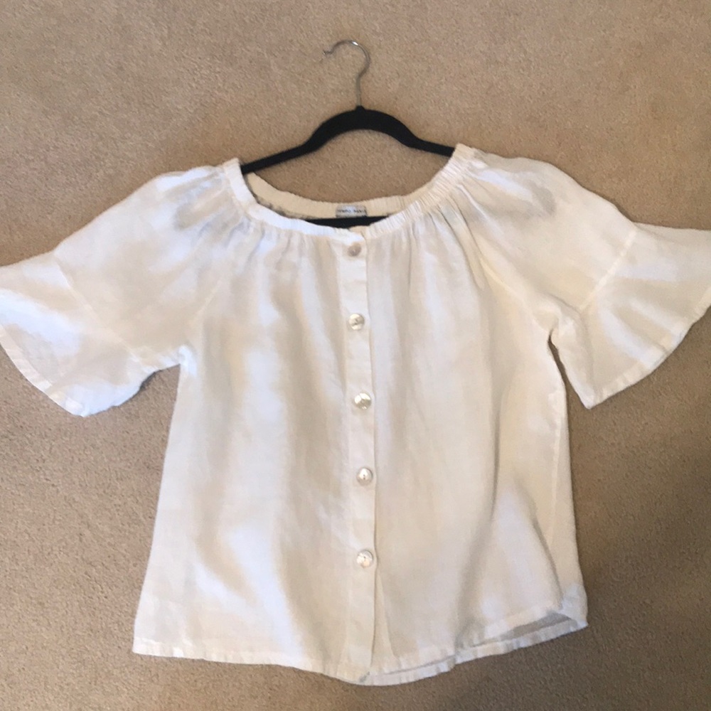 White shirt with flutter sleeves.